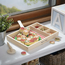 Wooden pizza play set with striped tray and stacked pizza toppings pieces