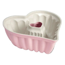 Pink heart-shaped fluted nonstick baking pan with ridged interior