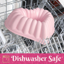 Pink heart-shaped fluted nonstick pan placed in a dishwasher rack