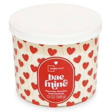 Valentine hearts 3-wick candle in clear jar with red heart label and no flame.