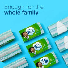 Puffs Plus Lotion tissue boxes, green packages laid out with folded tissues