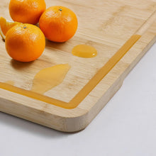 Bamboo cutting board with built-in juice groove along the edge, natural light wood