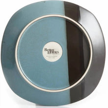 Teal striped dinner plate, circular top view with raised border