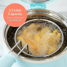 Aqua electric deep fryer basket with hot oil bubbling during cooking