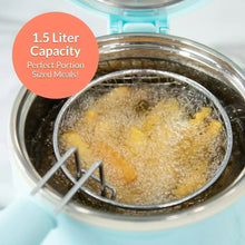 Aqua electric deep fryer with heating chamber and frying basket submerged in hot oil.