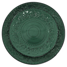 Dark green dinner plate with circular medallion and raised embossed scrollwork