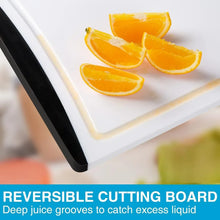 White plastic cutting board with deep juice grooves holding orange slices
