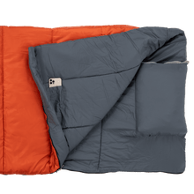 Adult sleeping bag with dark gray shell and orange inner panel, padded baffles