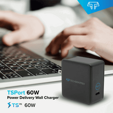 Techsmarter 60W USB-C wall charger on desk near hands using a laptop keyboard