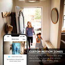 White indoor security camera on base with smartphone screen showing motion zones