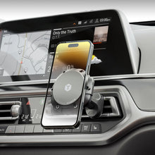 Magnetic phone mount holding a phone in a car vent area