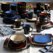 Blue and dark square dinner plates with assorted bowls and mugs