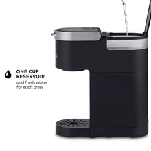 Black Keurig K-Mini pod coffee maker with one-cup reservoir and open top view