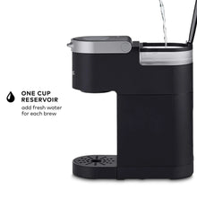 Black Keurig K-Mini single serve coffee maker with top open and water stream