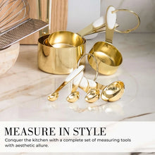 Gold-toned measuring cups and spoons with white silicone tips