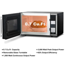 Countertop microwave oven with open door and 0.7 cu ft capacity label on front
