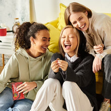 RITZ fudge mini cracker snack packs in hands during family snack time