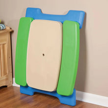 Kids play table with beige top, blue frame, green side panels, and fold-up storage door
