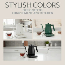 Black electric gooseneck kettle on countertop with small cup of tea