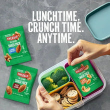 Emerald snack packs in lunch container, with green pouches and nut assortment visible.