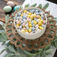 Bowl filled with pastel mini chocolate eggs for Easter serving