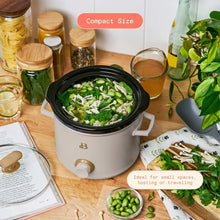 Porcini taupe slow cooker with black lid holding a green vegetable dish