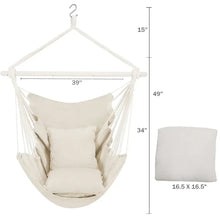 Beige hammock chair swing with hanging ropes, metal spreader bar, and stacked seat cushions