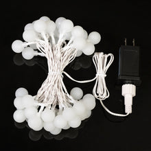 LED globe string light set with white globe bulbs and AC adapter