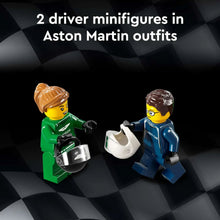 Two LEGO minifigures wearing green and blue racing outfits, holding accessories