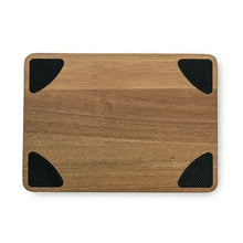 Acacia wood cutting board underside with four black triangle anti-slip grips
