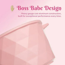 Pink ceramic Dutch oven side view with faceted finish and loop handle