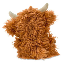 Brown plush Highland cow with shaggy fur, round ears and smiling face