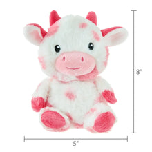 Pink and white cow plush sitting, round eyes and pink snout