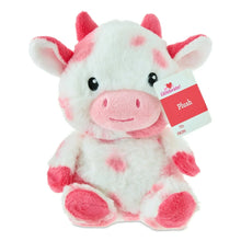 Pink and white cow plush with attached red hang tag