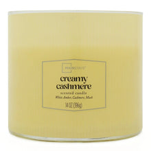 Creamy cashmere scented candle jar with cream wax and front label