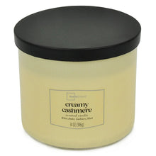 Creamy cashmere scented candle jar with cream wax and black lid