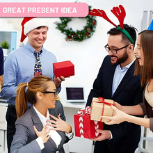 Pink desk stapler and tape dispenser near gift boxes at an office reception