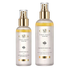d'Alba First Spray Serum set, two white bottles with gold pumps and yellow liquid