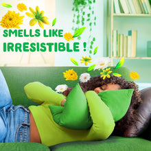 Green liquid laundry detergent bottle next to floral decor on a sofa