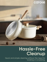 Speckled cream nonstick saucepan with lid and wooden handle on a board