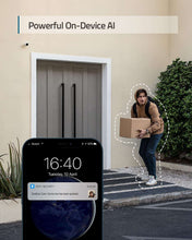 Smartphone displaying outdoor security camera app during delivery