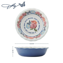 Ceramic pie dish with round shape, floral center medallion, blue scalloped sides