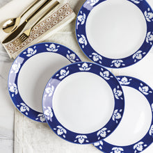 Round dinner plate set in indigo blue with white floral border and plain center