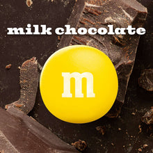 Milk chocolate candy with white M&M's logo on dark chocolate pieces