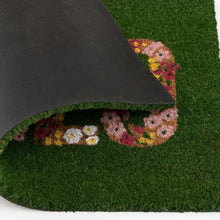 Outdoor coir doormat corner with dark backing, green edge and floral “HELLO”