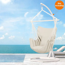 Beige hammock chair swing with hanging rope seat and two cushion pads