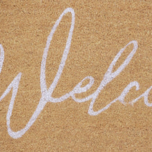 Coir doormat with white 'Welcome' script on tan fiber surface