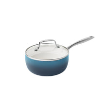 Denim blue ceramic non-stick saucepan with stainless steel handles and glass lid