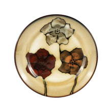Stoneware dinner plate with cream center, black outline, and painted poppy blossoms