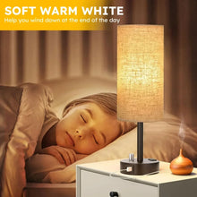 Bedside table lamp with linen shade and black base, warm bedside lighting